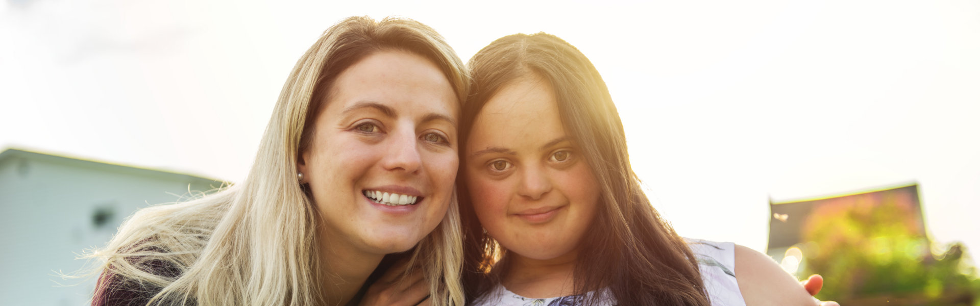 a woman with a girl smiling