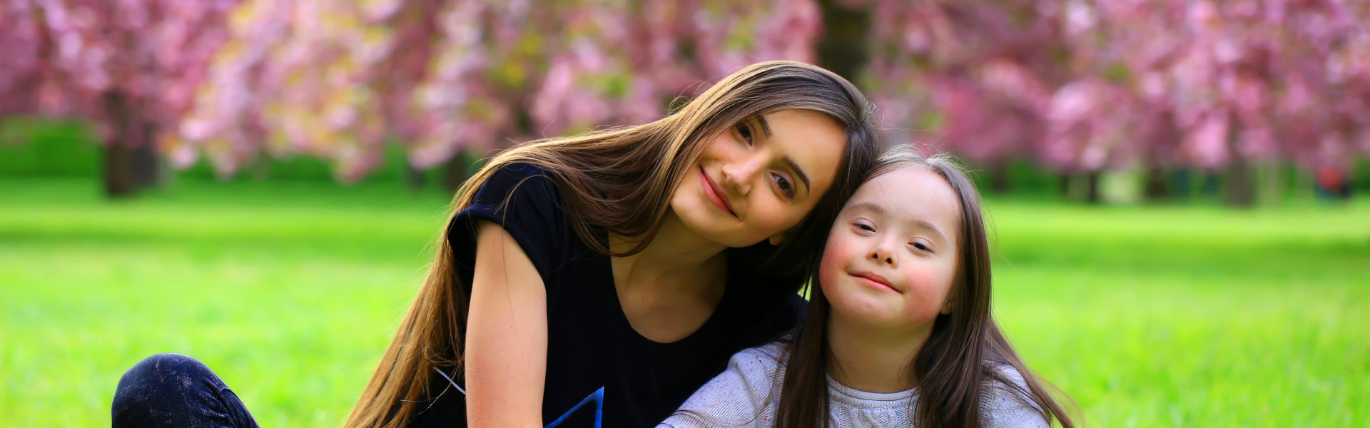 a woman with a girl smiling